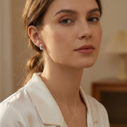 Green Emerald Huggie Hoop Earrings – emerald earrings, front view