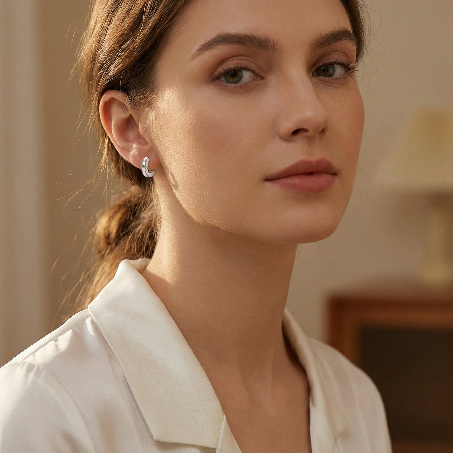 Green Emerald Huggie Hoop Earrings – emerald earrings, front view