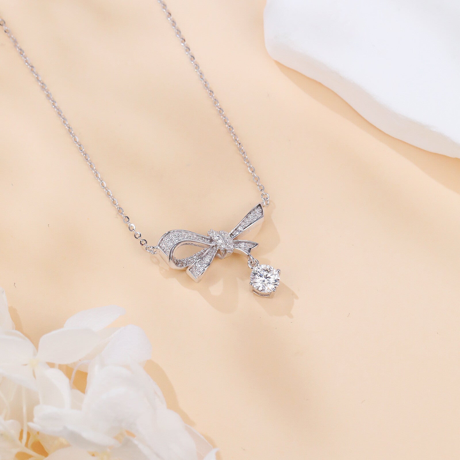 Silver Bow Necklace with Moissanite Charm – moissanite necklace, styling detail